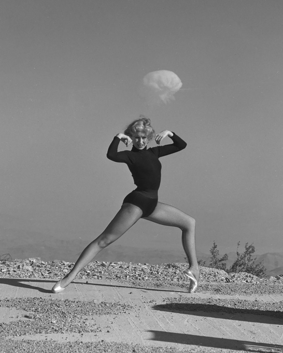 Dancer with a nuclear explosion in the background Nevada 1950s