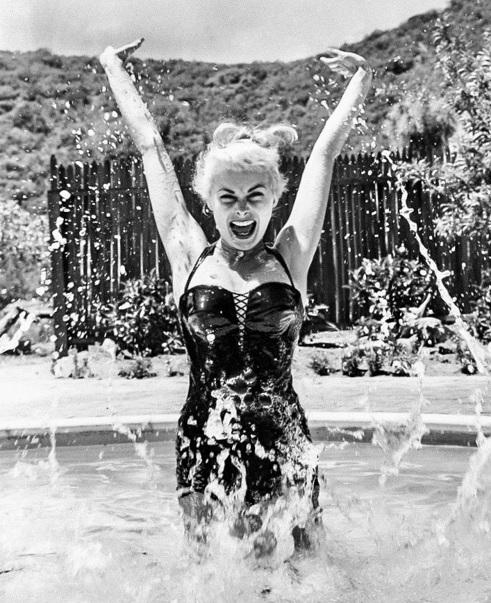 Janet Leigh having a splash at home in 1955.