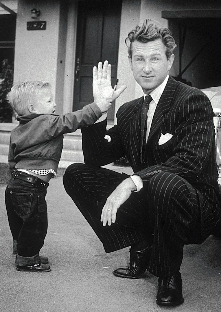 Lloyd Bridges in his driveway while his young son, Jeff in 1951