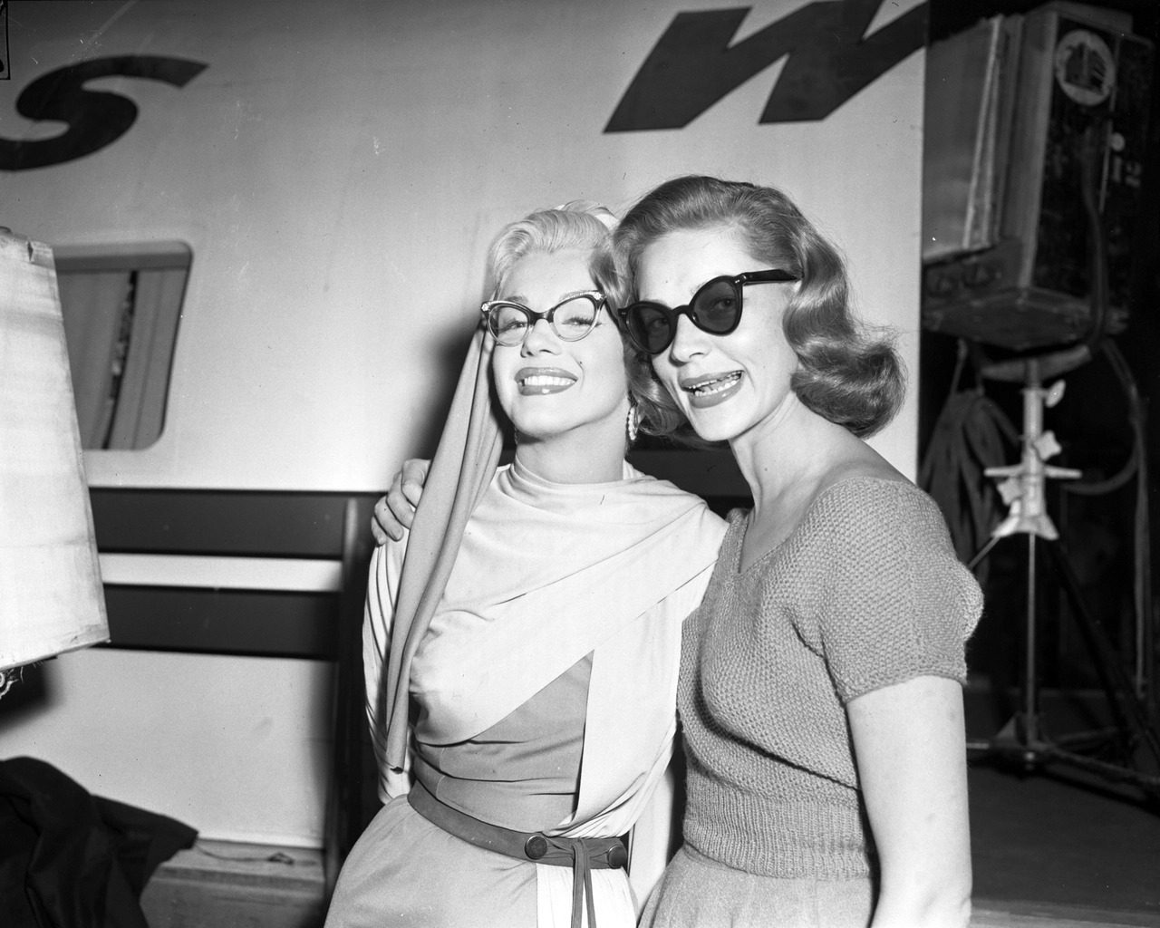 Marilyn Monroe and Lauren Bacall during a break from filming on the set of “How to Marry a Millionaire”, 1953