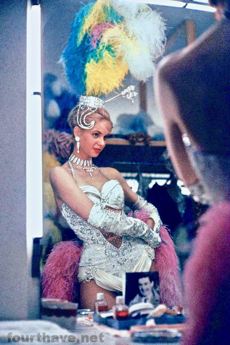 Showgirl at the Stardust Hotel adjusting her feathers, Las Vegas, 1958