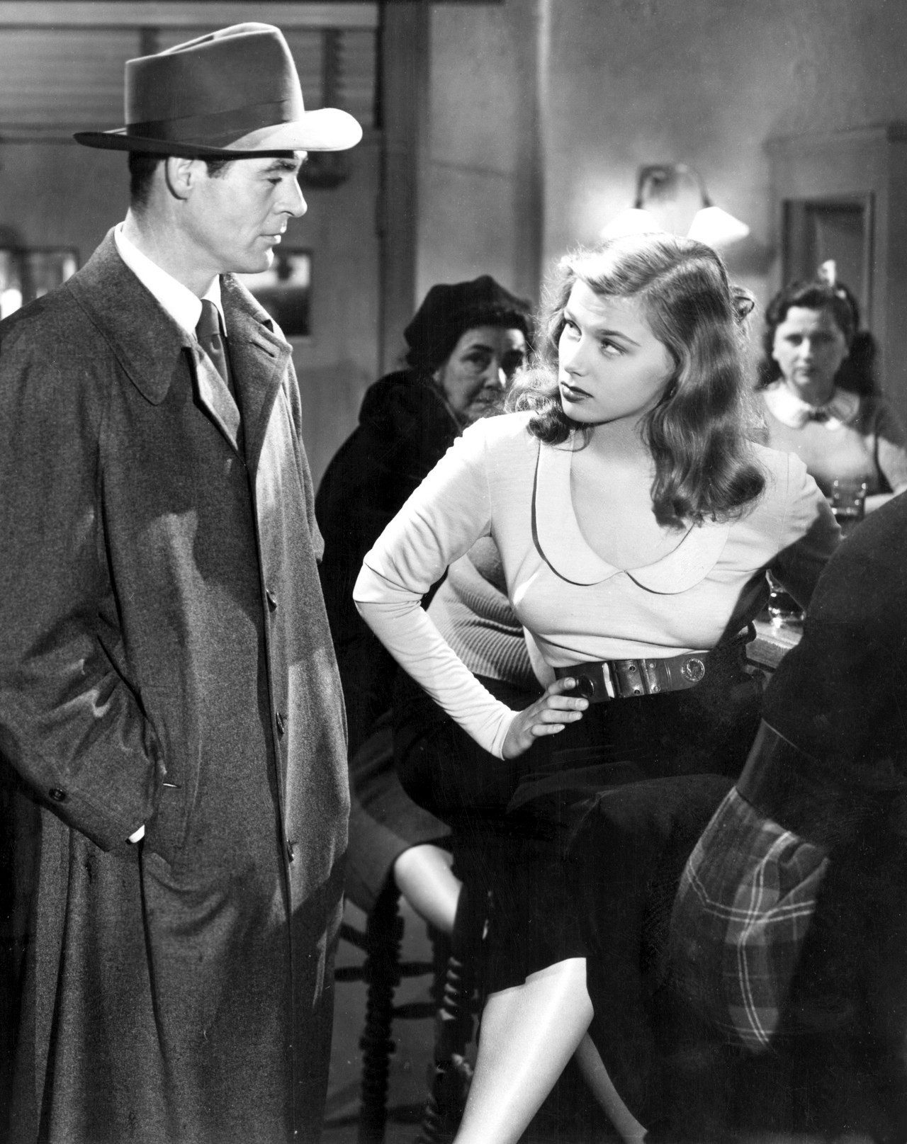Robert Ryan and Nita Talbot in an film noir scene from "On Dangerous Ground" (1951)
