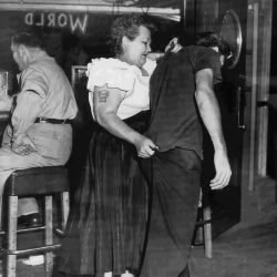 “Cairo Mary,” Bouncer At Shanghai Reds (5th And Beacon In San Pedro, Ca) Escorts A Customer To The Door. 1953
