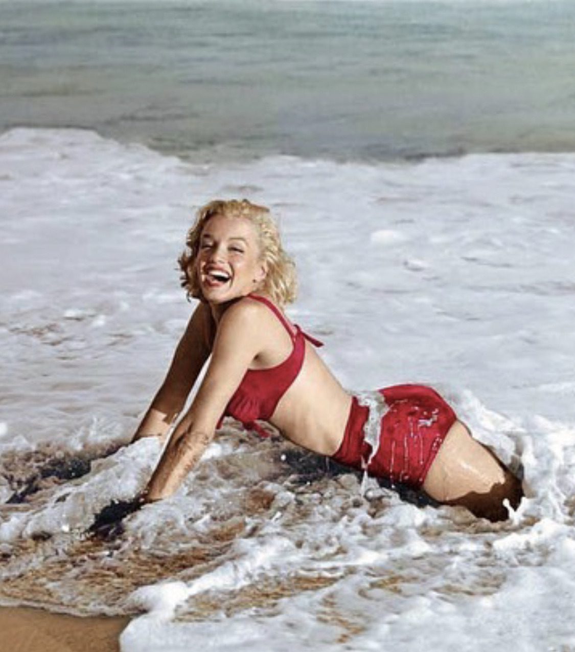 Marilyn Monroe photographed in the surf of Santa Monica beach, 1952