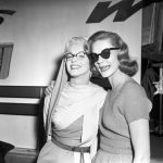 Marilyn Monroe and Lauren Bacall during a break from filming on the set of “How to Marry a Millionaire”, 1953.