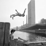 A man dives off a pier into the East River on May 21, 1955.