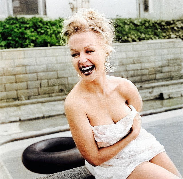 Greta Thyssen laughing during a photo shoot