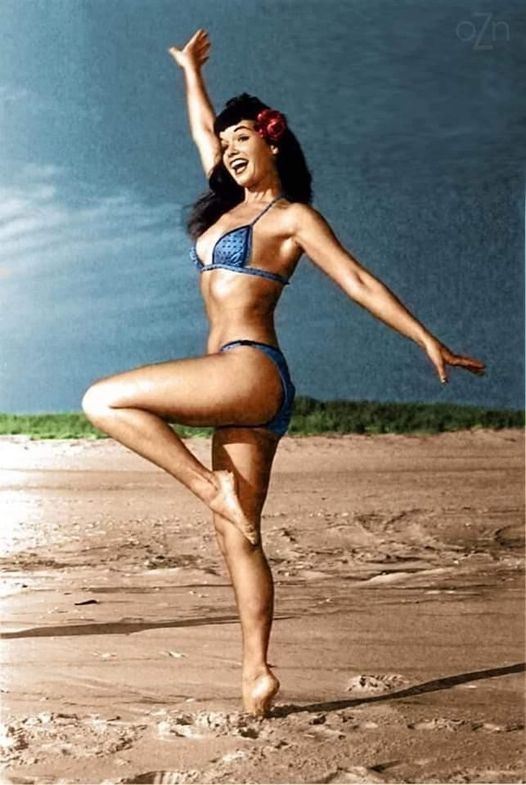Bettie Page showing off on the beach