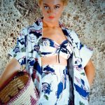 Portrait of Sheree North (1932-2005), US actress, singer and dancer, wearing print pattern beachwear and holding a raffia basket, ca. 1955.