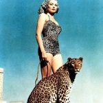 Gene Tierney with a leopard on the set of The Egyptian (1954)2