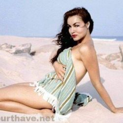 julie-newmar-in-a-towel-on-a-beach