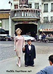 Zsa Zsa Gabor and Buster Keaton photographed outside the Moulin Rouge, Paris, 1959.